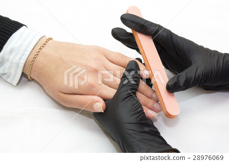Woman hands doing manicure beauty salon close-up Woman hands doing manicure beauty salon close-up 28976069