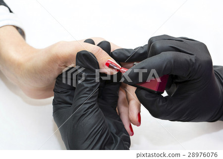 Woman hands doing manicure beauty salon close-up 28976076
