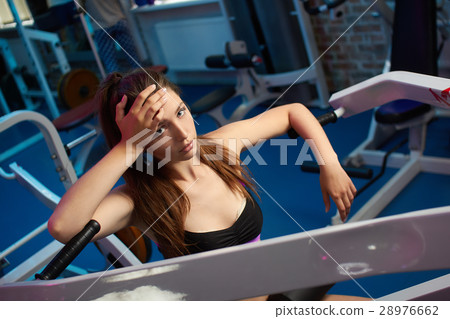 Beautiful girl take breath during fitness workout Beautiful girl take breath during fitness workout 28976662