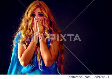 Frightened woman screaming with fear indoor at Frightened woman screaming with fear indoor at 28978321