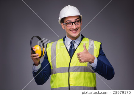 Man wearing hard hat and construction vest Man wearing hard hat and construction vest 28979170