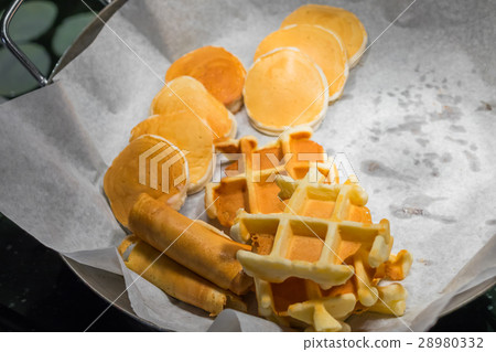 Assortment of fresh pastry on table in buffet . Assortment of fresh pastry on table in buffet . 28980332
