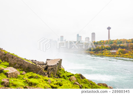 American side of Niagara Falls during sunrise . 28980345