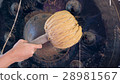 Hand of Asian young man hit big gong. 28981567