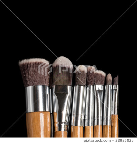 Collection of professional makeup brushes on black Collection of professional makeup brushes on black 28985023