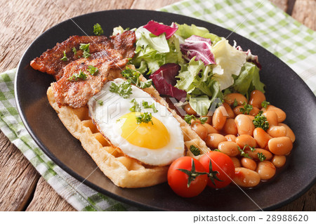 Breakfast with fried egg, waffles, bacon, lettuce 28988620