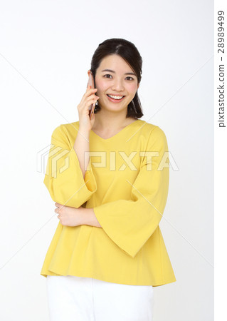 A smartphone and a woman A smartphone and a woman 28989499