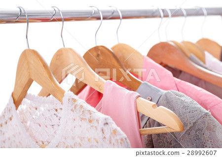 gray, pink womens clothes on hangers on rack on 28992607