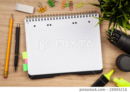 Open notepad with office supplies Open notepad with office supplies 28993218
