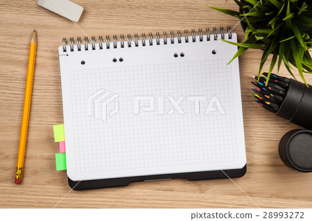 Open notepad with office supplies 28993272