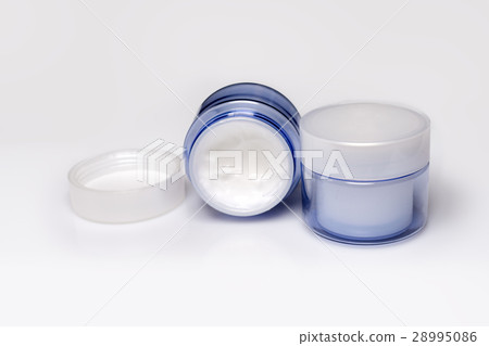 Two containers of moisturizing face cream on white Two containers of moisturizing face cream on white 28995086