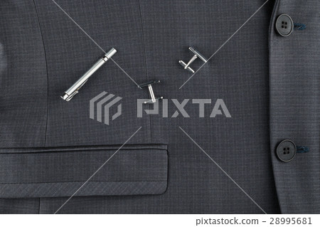 Classic suit, cufflinks and tie clip, close-up. Classic suit, cufflinks and tie clip, close-up. 28995681