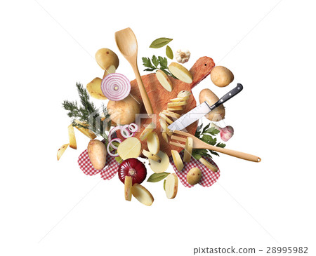Potatoes chopped and whole on old kitchen Board 28995982