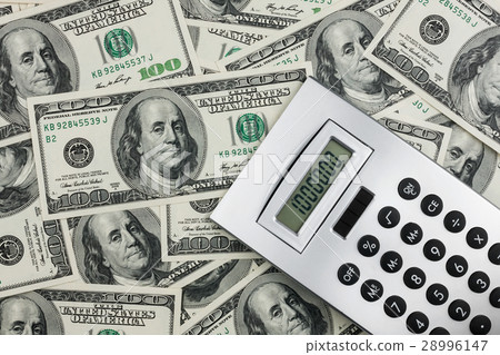 Calculator and dollars  closeup. 28996147