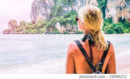 Blond beautiful Women with Sunglasses and Backpack Blond beautiful Women with Sunglasses and Backpack 28998212