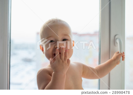 Portrait of a happy little boy standing near Portrait of a happy little boy standing near 28998478