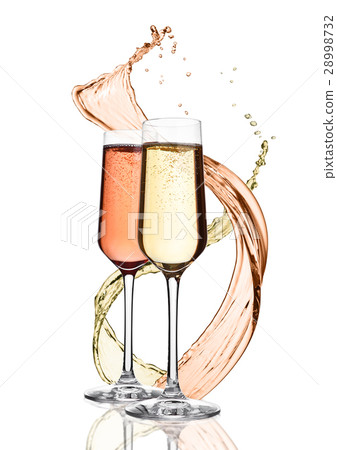 Glasses of yellow and pink champagne with splashes Glasses of yellow and pink champagne with splashes 28998732