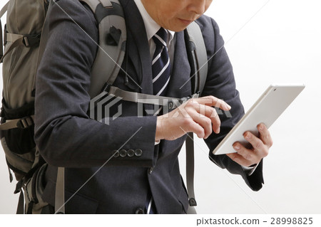 A businessman who searches for Zach with a tablet terminal 28998825