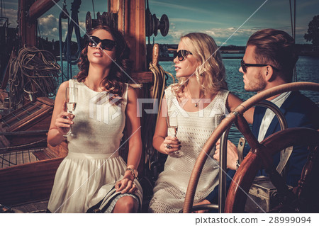 Stylish wealthy friends having fun on a luxury 28999094