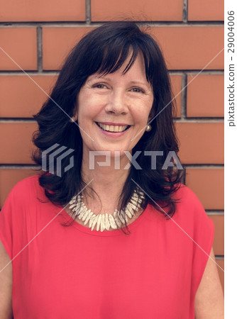 Outdoors portrait of a mature lady smiling Outdoors portrait of a mature lady smiling 29004006