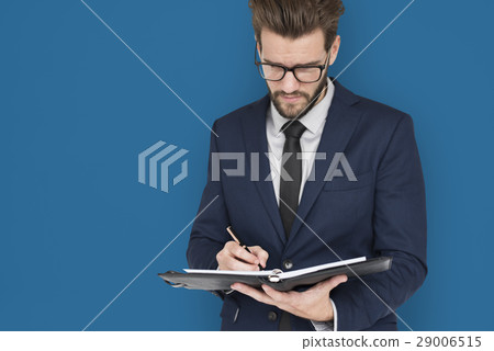 Caucasian Business Man Writing Notes Caucasian Business Man Writing Notes 29006515