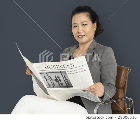 Asian Business Woman Reading Newspaper 29006516