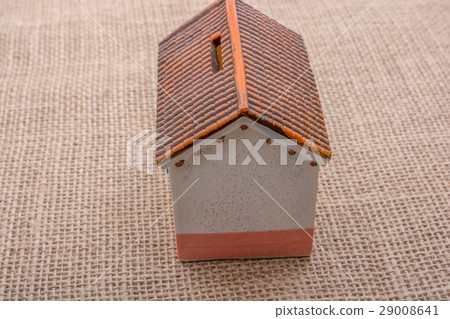 Little model house on a brown background Little model house on a brown background 29008641