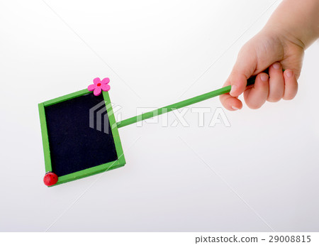 Hand holding a noticeboard Hand holding a noticeboard 29008815