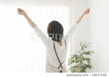 The back of the middle woman taking a morning sun The back of the middle woman taking a morning sun 29011546