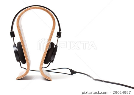 Black Pair of Headphones on a wooden stand 29014997