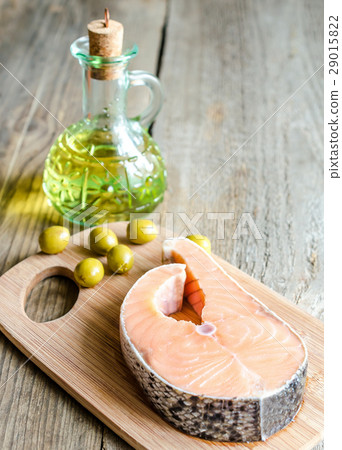 Food with unsaturated fats - salmon and olive oil 29015822