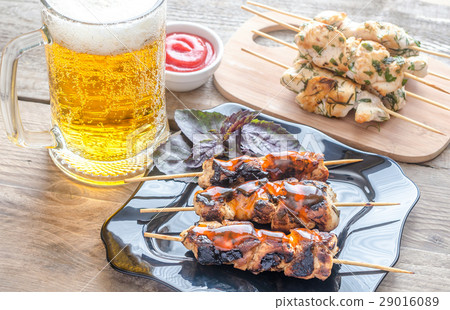 Grilled chicken skewers with herbs and spicy sauce 29016089