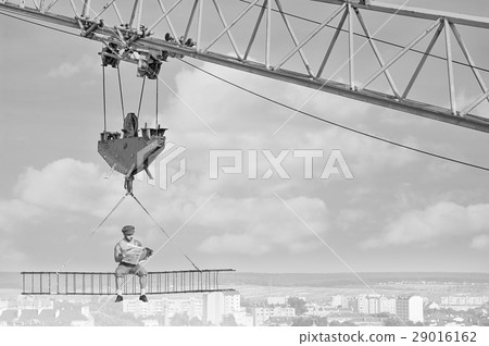 Retro styled handyman with a newspaper at 29016162