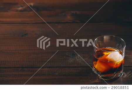 Cola with cognac or rom in glass and ice cubes Cola with cognac or rom in glass and ice cubes 29018851