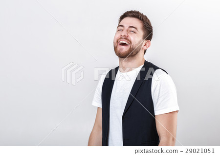 portrait of young attractive smiling man in white 29021051