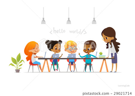 Happy children sitting at laptops and learning 29021714