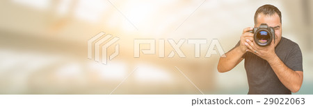 Hispanic Man with DSLR Camera Wide Banner with Room For Copy. Hispanic Man with DSLR Camera Wide Banner with Room For Copy. 29022063