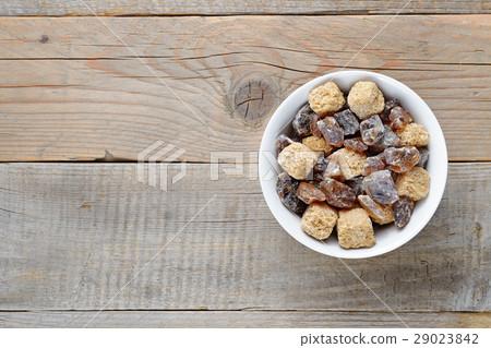 Brown sugar in bowl on table top view 29023842
