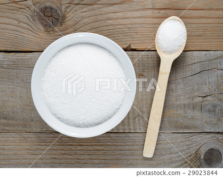 Sugar in bowl and spoon on table 29023844