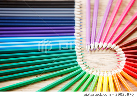 Close up stack colour pencils on wooden background 29023970
