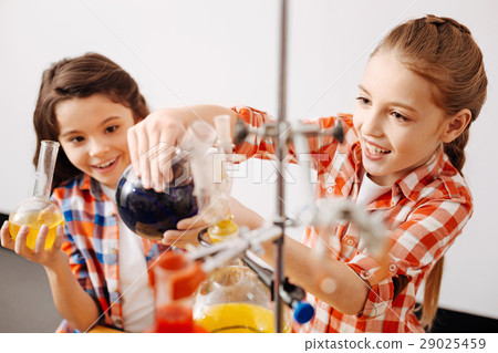 Delighted pretty girls enjoying their chemistry 29025459