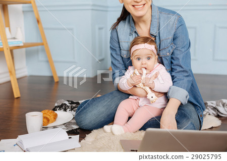Adorable young family spending some time together Adorable young family spending some time together 29025795
