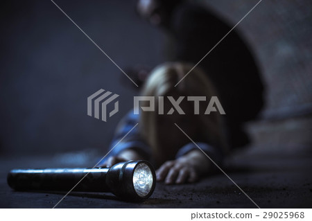 Weak blonde woman trying reaching a flashlight Weak blonde woman trying reaching a flashlight 29025968