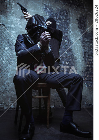 Scared trapped businessman caught in a middle of a Scared trapped businessman caught in a middle of a 29026224