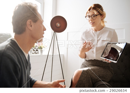 Attractive blonde woman talking to a man 29026634