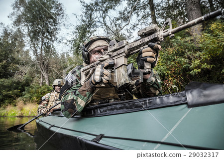 Militants in army kayak Militants in army kayak 29032317