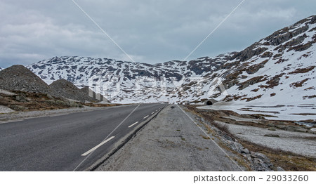Road #63 with snowy mountain to Geiranger fjord. Road #63 with snowy mountain to Geiranger fjord. 29033260