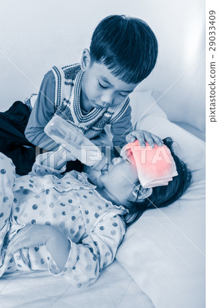 Asian girl with cold and flu sucking up milk 29033409