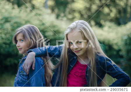 Portrait of two cute little girls enjoying summer. Portrait of two cute little girls enjoying summer. 29035671