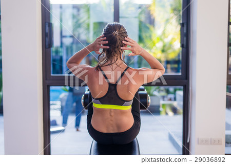 Attractive fit woman working out abs in fitness 29036892
